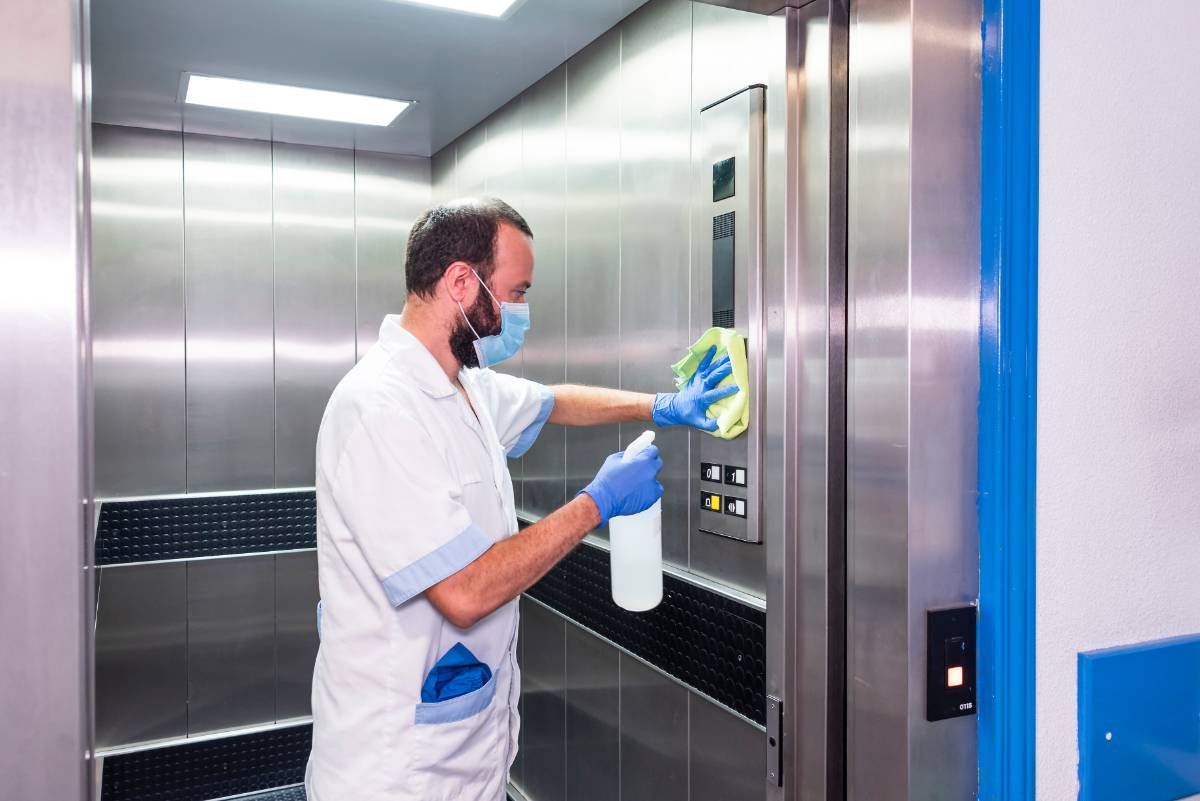 cleaning staff performing disinfection hygiene work hospital facilities